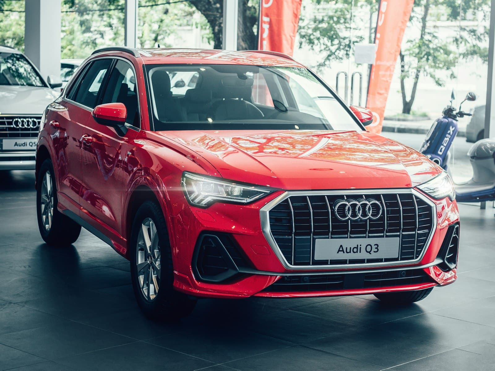 2025 Audi Q3 S line in Tango Red in the showroom