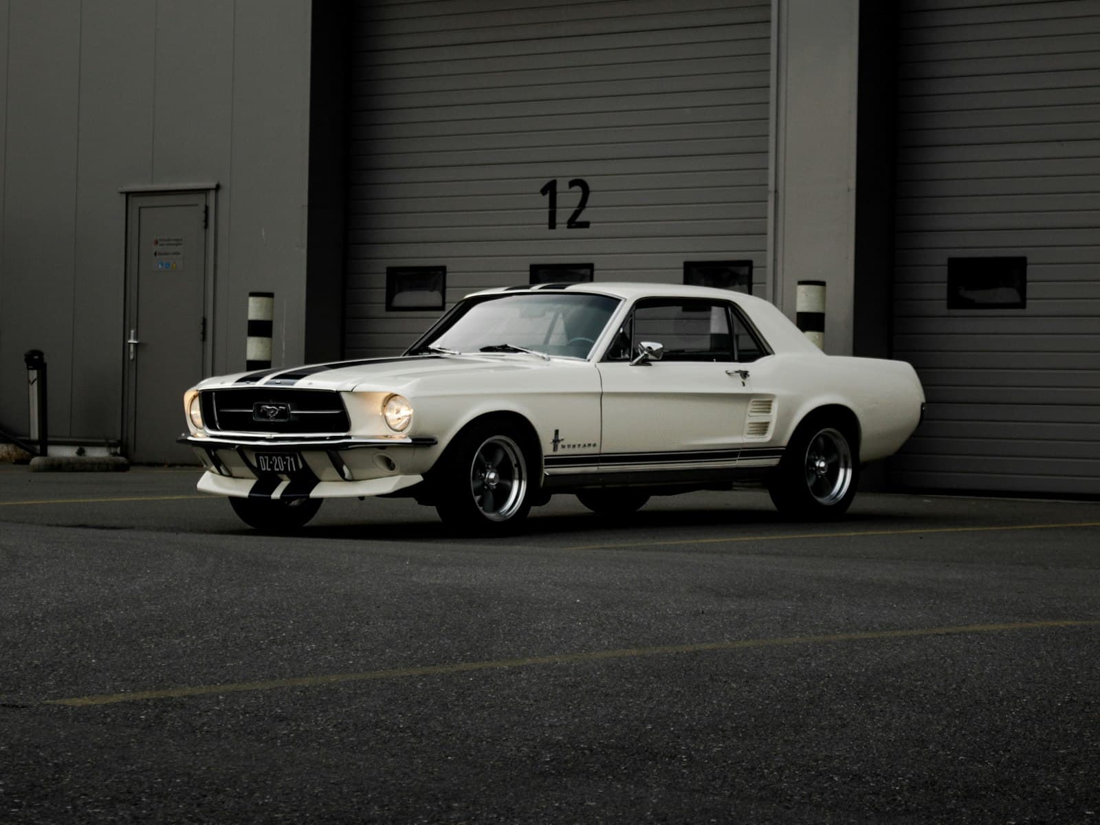 1967 Ford Mustang coupe in Wimbledon White with blue stripes