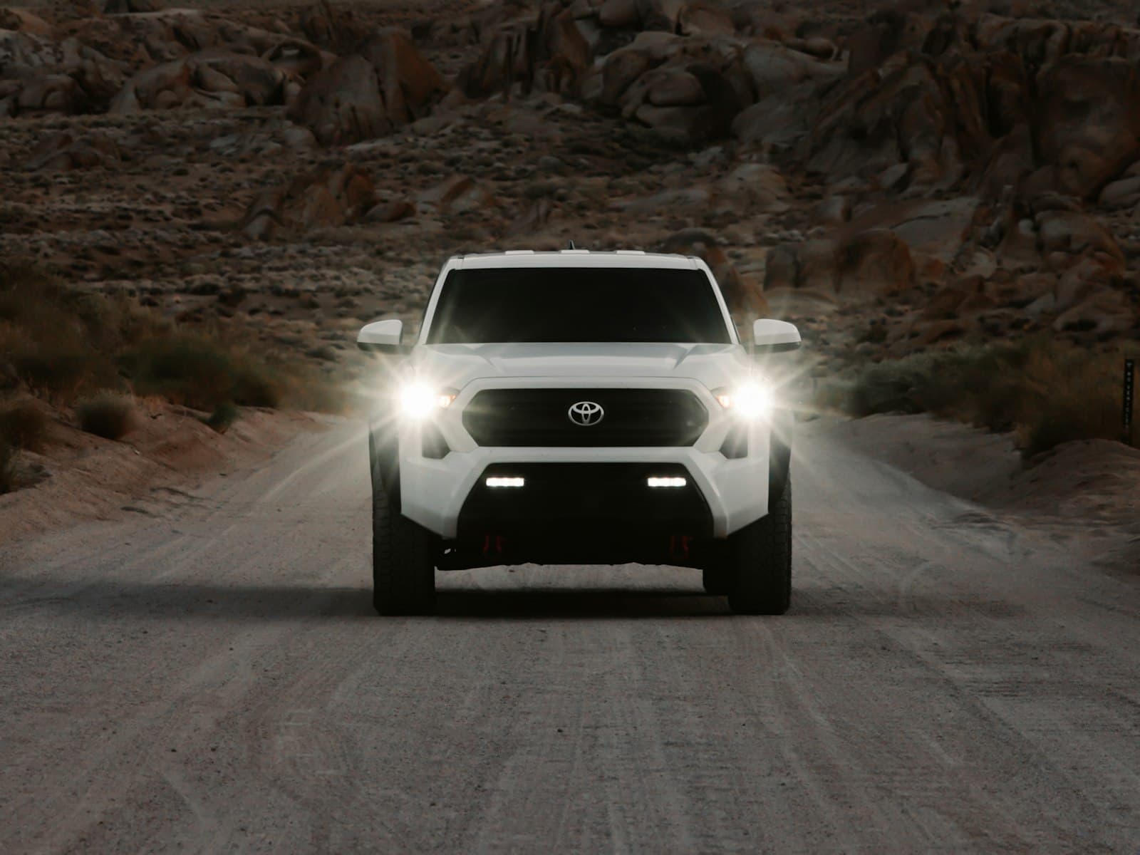 2024 Toyota Tacoma TRD Off-Road in Ice Cap on a desert road